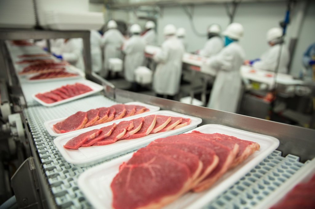 Pork Steaks On Conveyor piedmont plastics